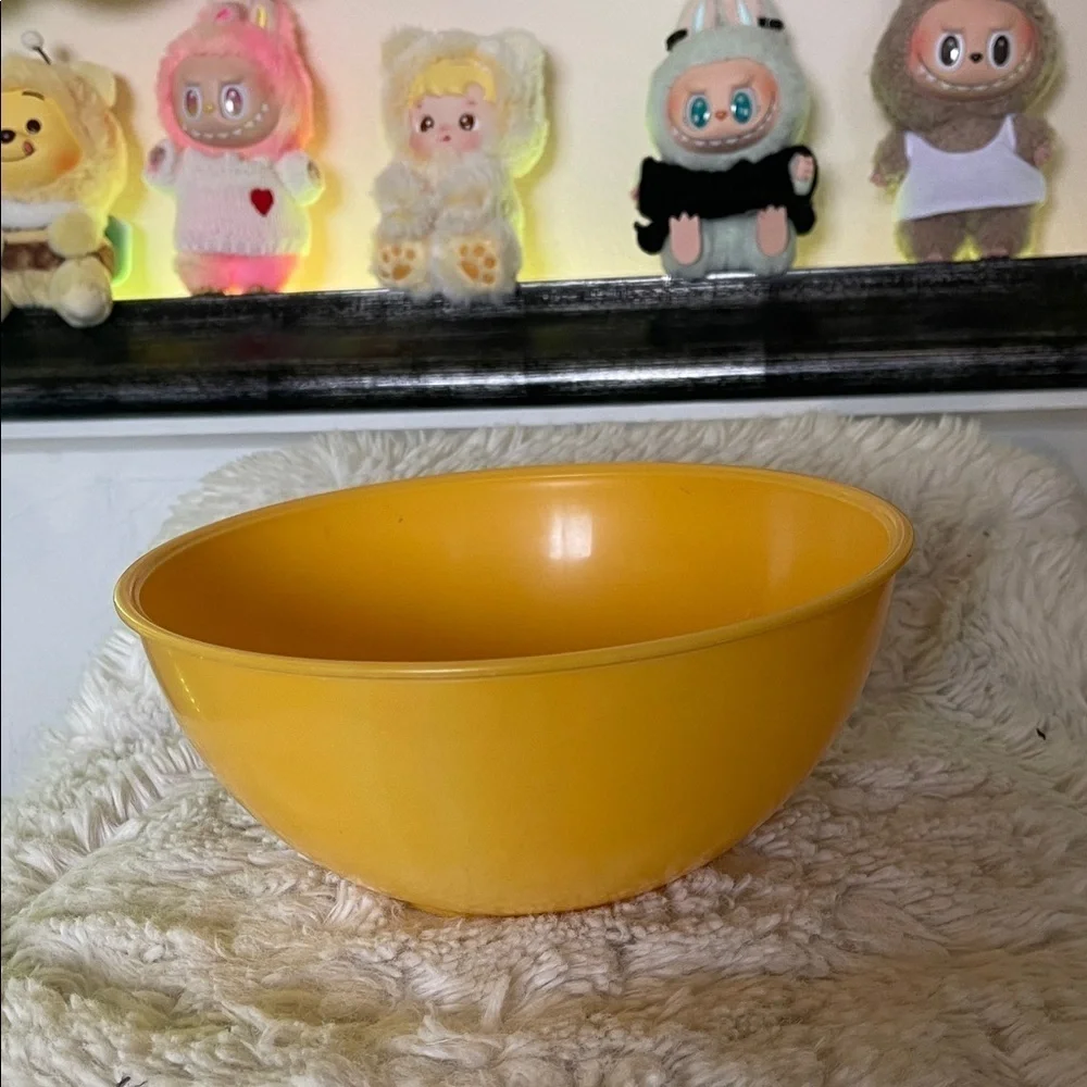 Yellow  bowl not new but never used just stored away made of plastic